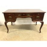 An early 20th century style Ladies writing table with drawers stamped S and P. Shapland and