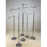 A quantity of six chrome adjustable drapers stands