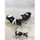 Beswick Friesian cattle. A bull, cow and a calf. Champion Coddington Hilt bar bull marked to front