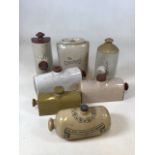 A collection of stoneware foot warmers including The O-solokosi and a Doulton improved foot warmer