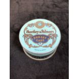 A miniature Huntley and Palmers cake tin W:5.5cm x H:3cm
