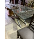 A contemporary designer style glass topped table. W:180cm x D:90cm x H:73cm