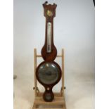 A Georgian walnut inlaid barometer and thermometer by J Martin, Maidstone with spirit level and