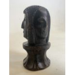 A small carved wooden three face bust. Initialled M.T to base. H:13cm