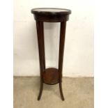 An Edwardian mahogany double shelved inlaid plant stand.