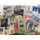 A collection of wartime ephemera, suffragette news sheet, newspapers, ration books, clothing