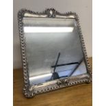 A silver dressing table mirror marked 999 with London hallmark. W:28cm x H:34cm