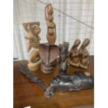 A collection of wooden tribal items and carved treen. To include a ebony head and a spitting cobra.