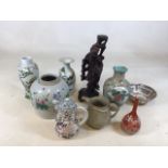A quantity of oriental ceramics also with a carved wooden figure