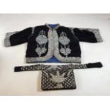 An embroidered velvet bolero jacket also with an Indian embroidered evening bag