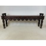 A Victorian carved oak window seat or hall bench. a.f split to top. W:132cm x D:28cm x H:49cm