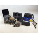 A quantity of cameras including Polaroid, Kodak Brownie, Brownie model E and others