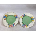 A pair of Clarice Cliff Spring Crocus plates. Slight wear to base W:16cm