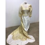 A Ronald Joyce wedding dress with train and veil. Size 18