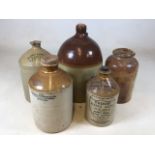 A collection of stoneware flagons including Exeter, Belfast and 1934 Tudor Minerla Water Co Ltd.