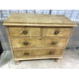 A small Antique pine chest of drawers within two short over two long drawers with brass handles. W: