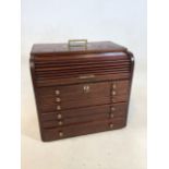 A WW1 Campaign Dentistry box and contents. With tambour top and six drawers. With brass fittings and