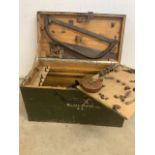 A vintage box with a collection of tools. Marked with military MJR.J.E.L Carter.