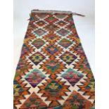 A Chobi Kilim runner W:67cm x H:150cm