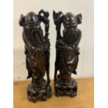 A pair of Oriental witch Doctors H:37cm