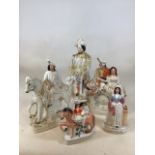 A quantity of Staffordshire figures including Going To Market, Miss Nightingale, The Lion Slayer and