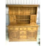 A two piece reclaimed pine Welsh dresser made by cabinet maker Tim Rae-Duke.