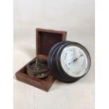 A boxed brass sundial compass and a Negretti and Zambra metal surround circular barometer