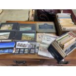 A large collection of postcards and first day covers.