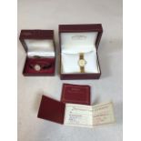 A ladies gold plated Rotary watch on metal bracket model 535166 in original box, also with