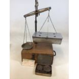 A boxed set of scales with tin of weights. By A H Griffin and Co Coventry