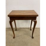 A queen and style Walnut quarter veneered card table. W:63cm x D:39cm x H:75cm