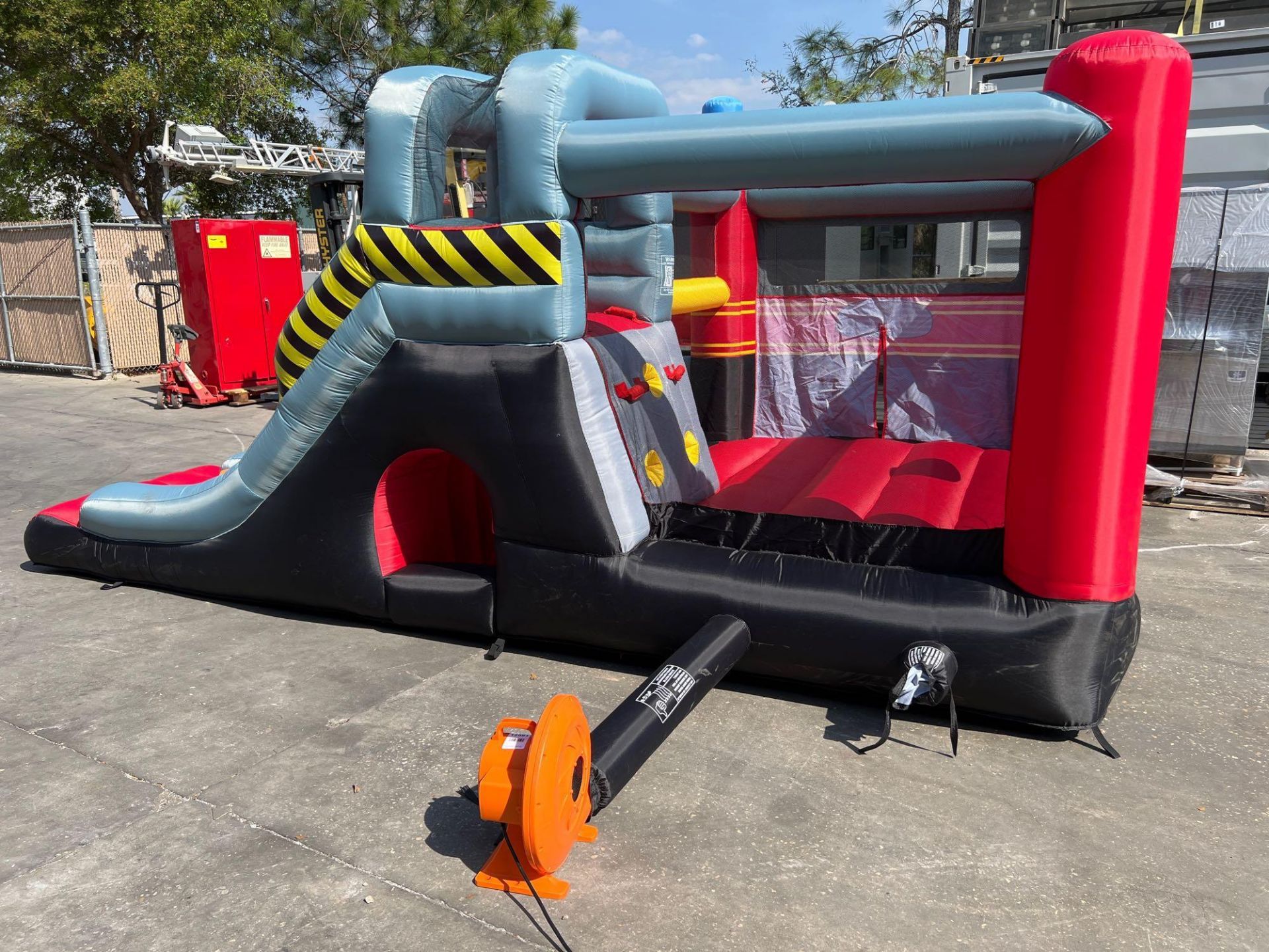 UNUSED BLOW-UP BOUNCY FIRE STATION PLAY YARD WITH SLIDE, VELCRO DARTS, BALLS, STAKES, & BLOWER - Image 5 of 12