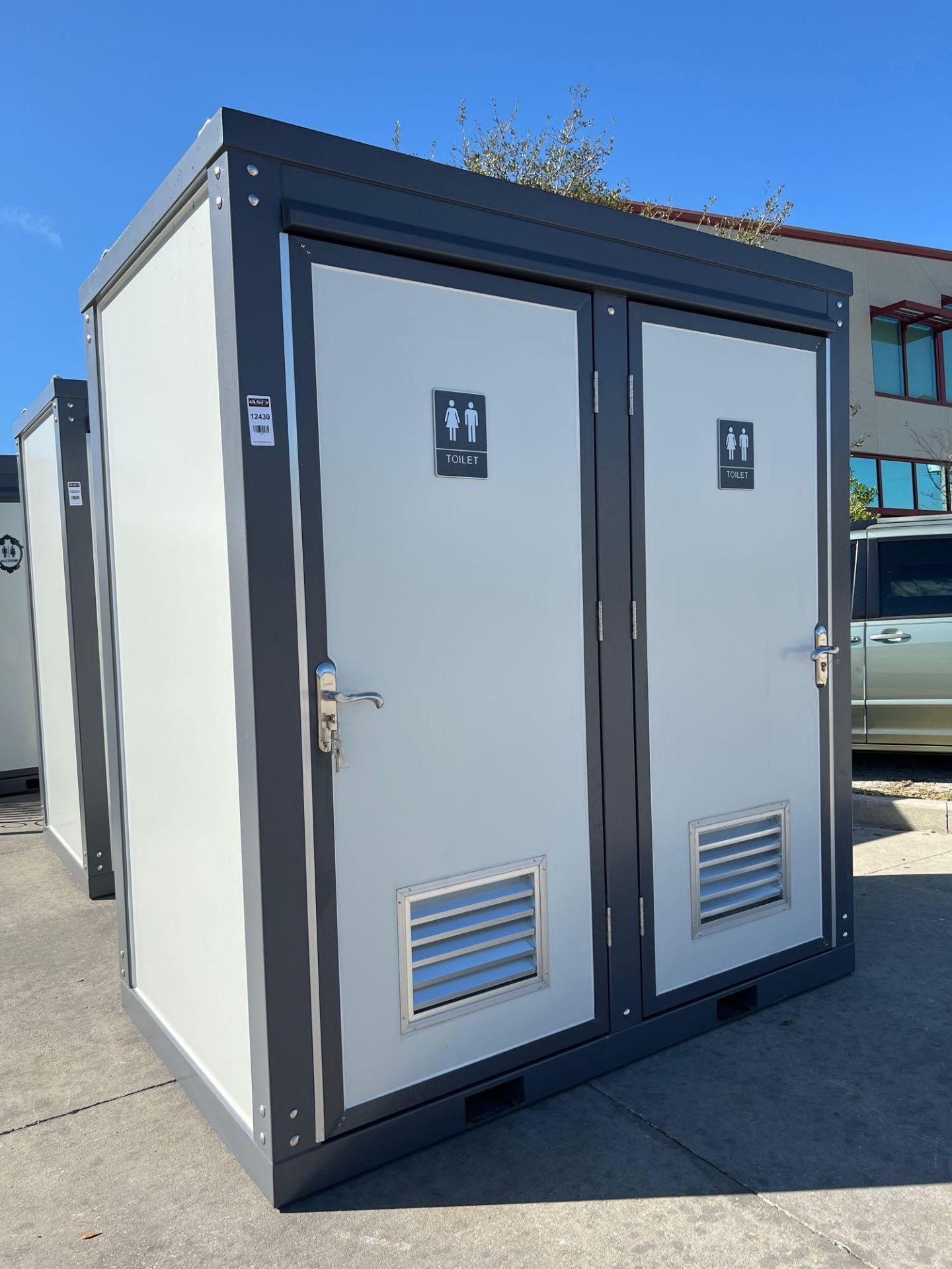 UNUSED PORTABLE DOUBLE BATHROOM UNIT, 2 STALLS, ELECTRIC & PLUMBING HOOK UP WITH EXTERIOR PLUMBING C