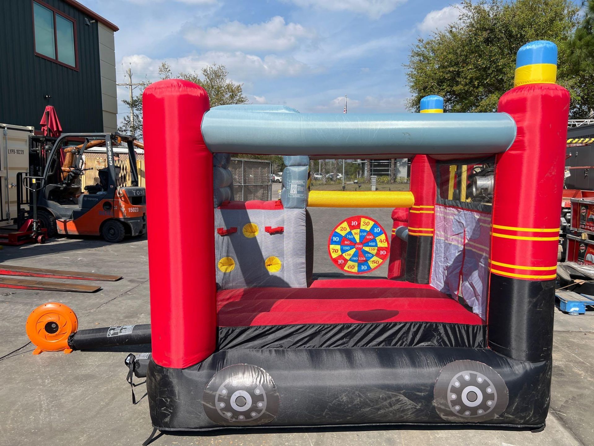 UNUSED BLOW-UP BOUNCY FIRE STATION PLAY YARD WITH SLIDE, VELCRO DARTS, BALLS, STAKES, & BLOWER - Image 7 of 12