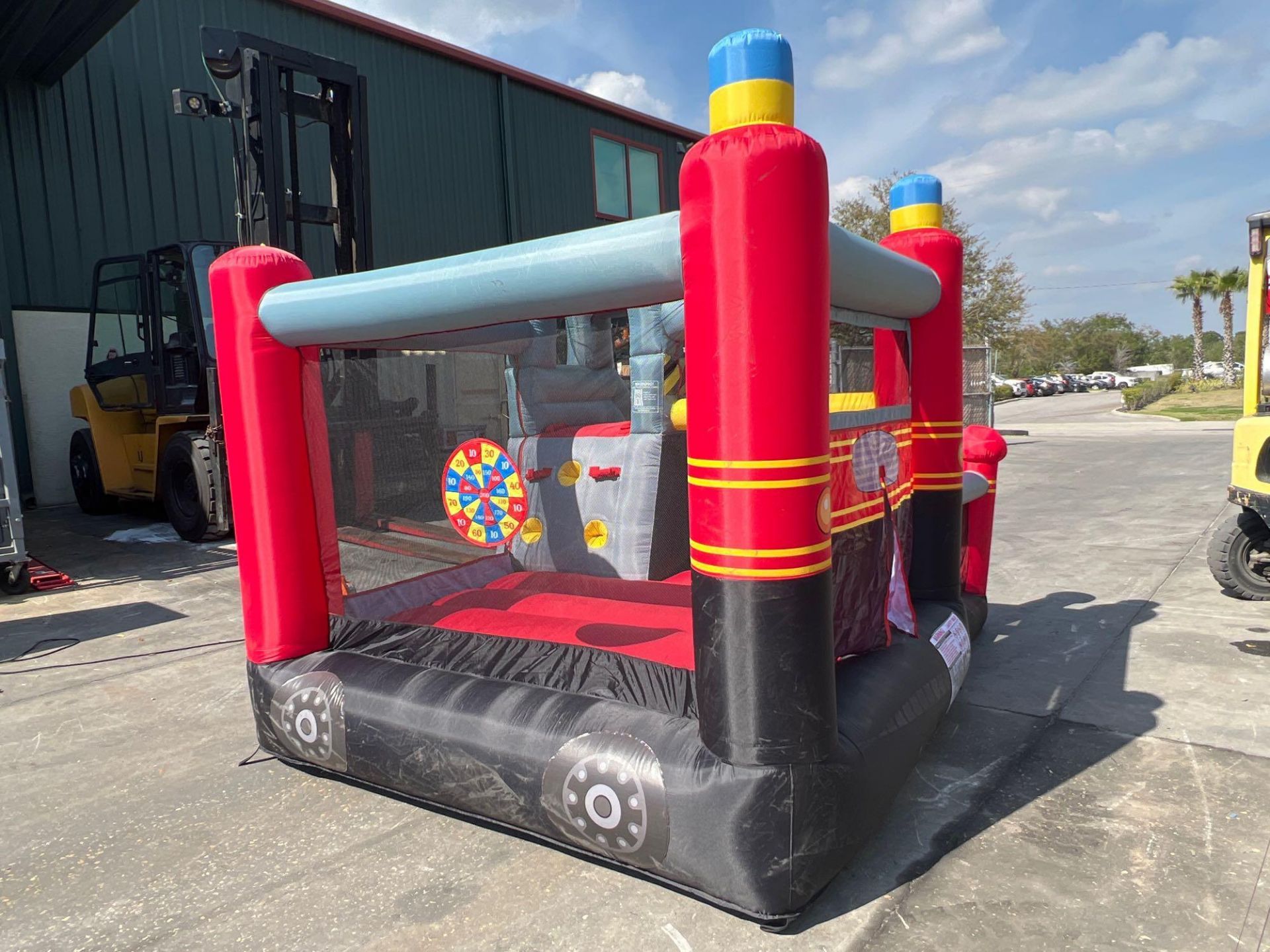UNUSED BLOW-UP BOUNCY FIRE STATION PLAY YARD WITH SLIDE, VELCRO DARTS, BALLS, STAKES, & BLOWER - Image 8 of 12