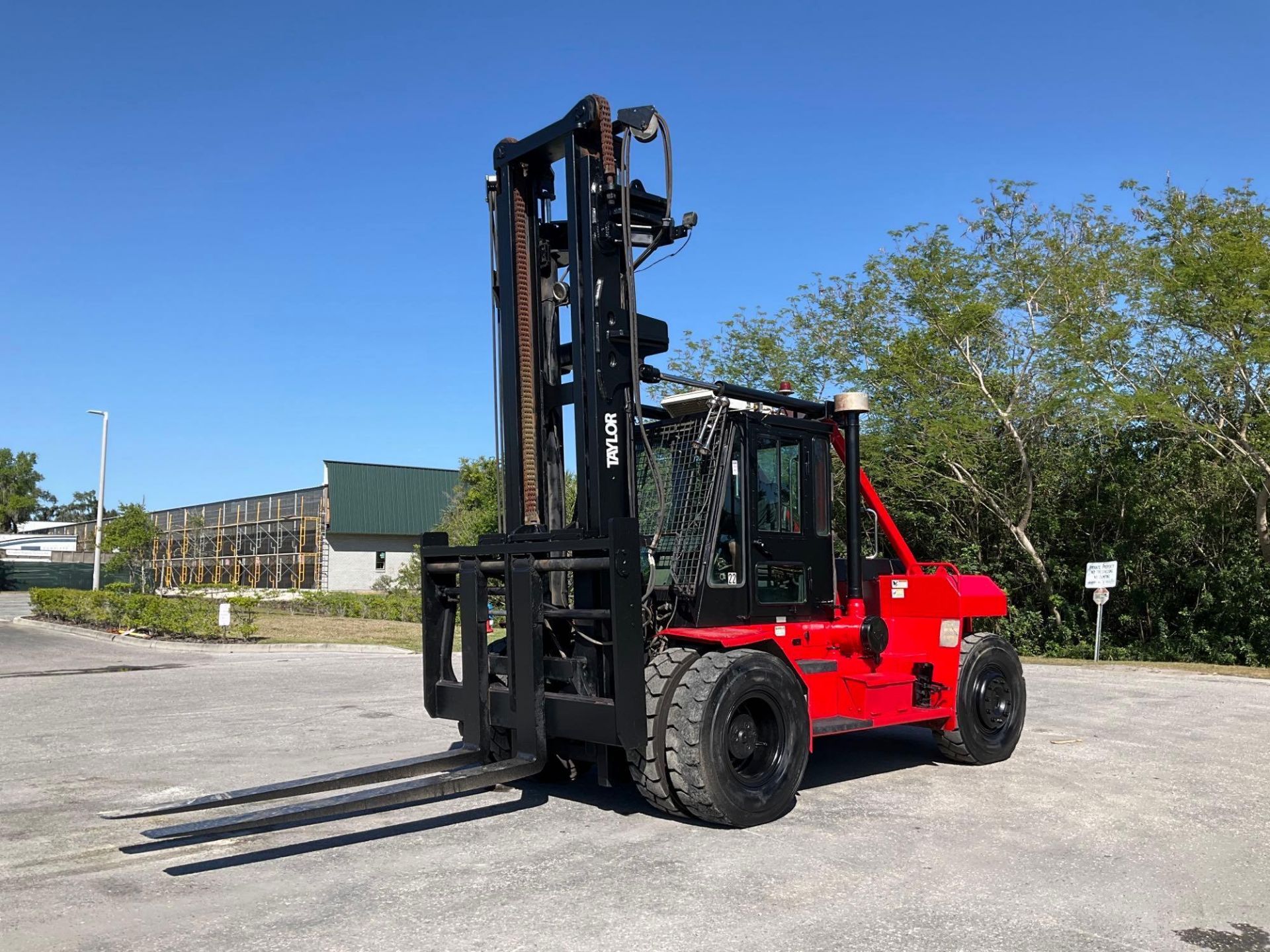 TAYLOR FORKLIFT MODEL T-300M, DIESEL, DOUBLE ENTRY ENCLOSED CAB, APPROX MAX CAPACITY 30,000LBS