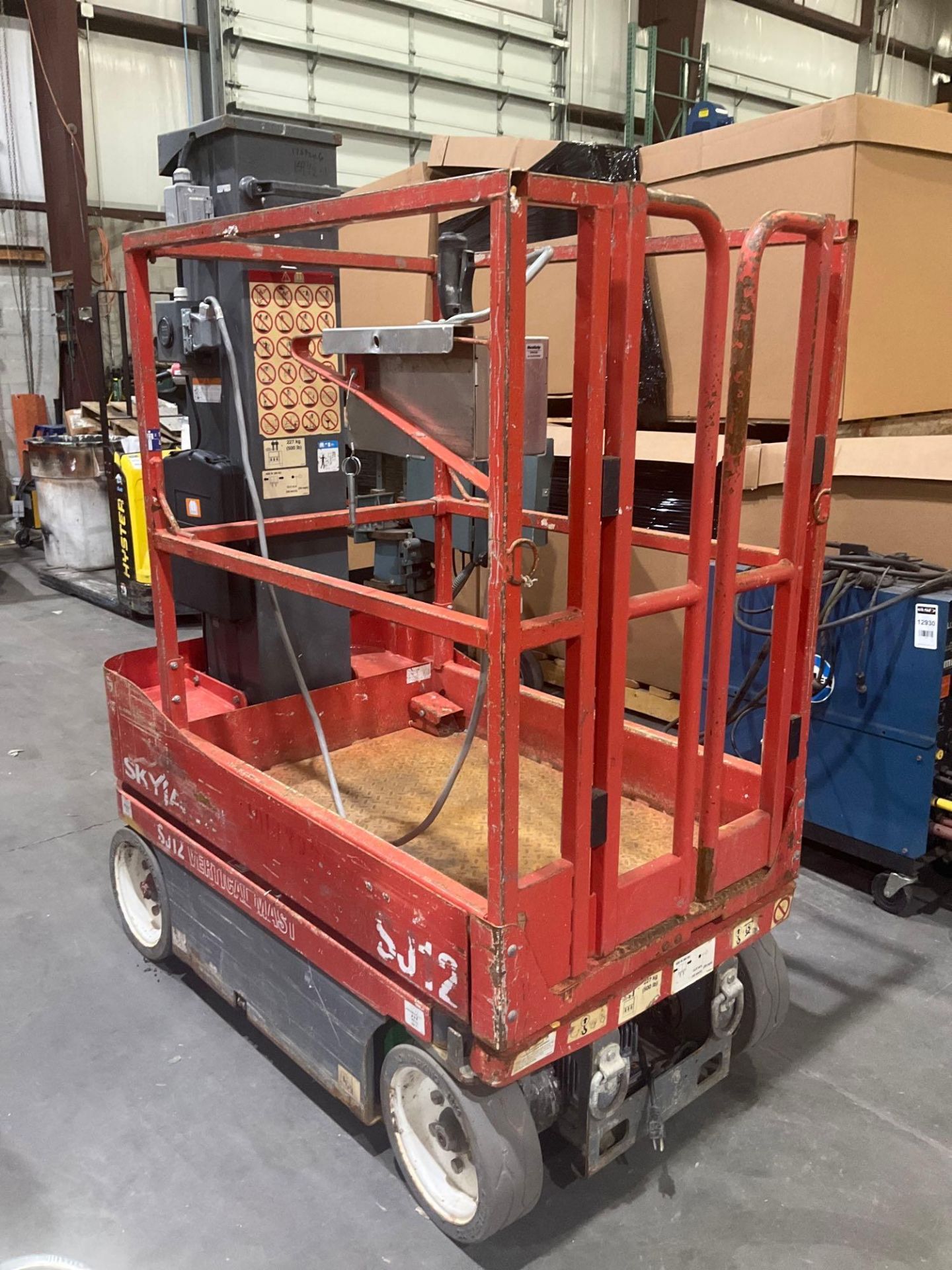 SKYJACK MANLIFT MODEL SJ12, ELECTRIC, APPROX MAX PLATFORM HEIGHT 12FT, NON MARKING TIRES, BUILT IN B