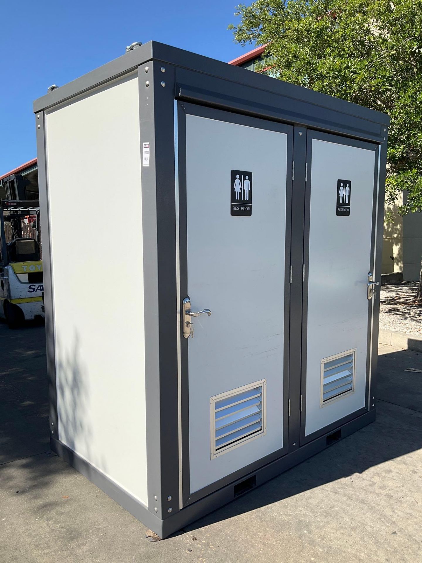 UNUSED PORTABLE DOUBLE BATHROOM UNIT, 2 STALLS, ELECTRIC & PLUMBING HOOK UP WITH EXTERIOR PLUMBING C