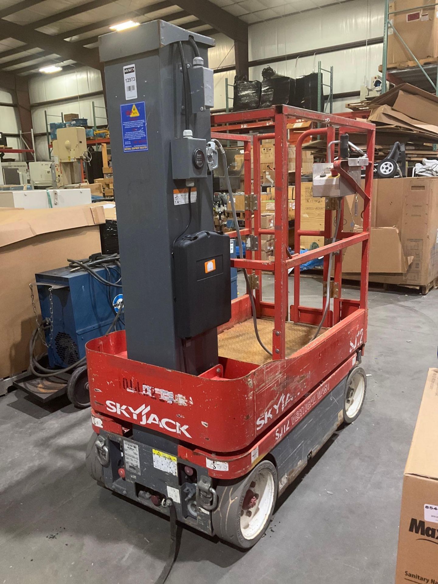 SKYJACK MANLIFT MODEL SJ12, ELECTRIC, APPROX MAX PLATFORM HEIGHT 12FT, NON MARKING TIRES, BUILT IN B - Image 2 of 13