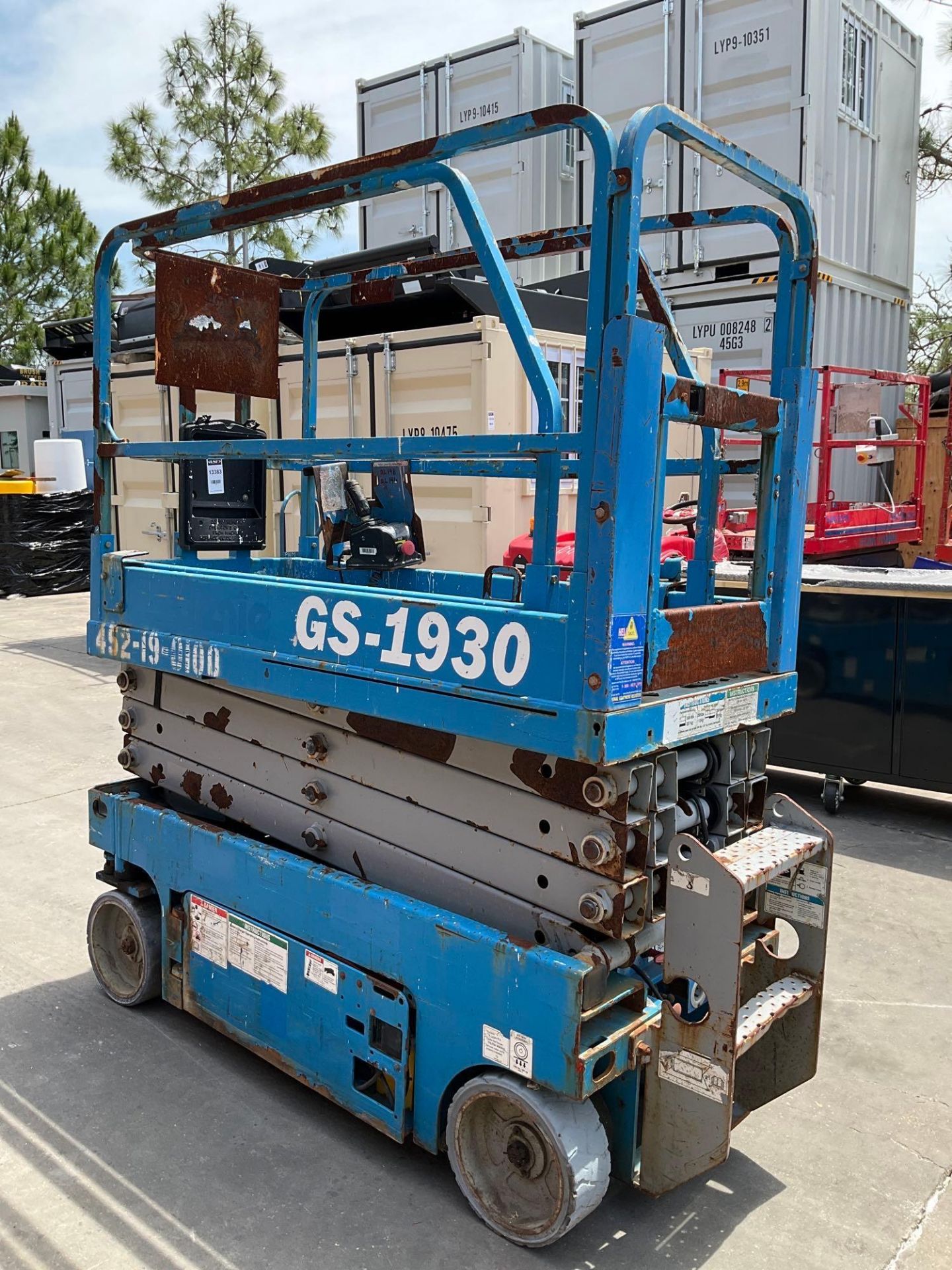 GENIE SCISSOR LIFT MODEL GS1930, ELECTRIC, APPROX MAX PLATFORM HEIGHT 19FT, BUILT IN BATTERY CHARGER