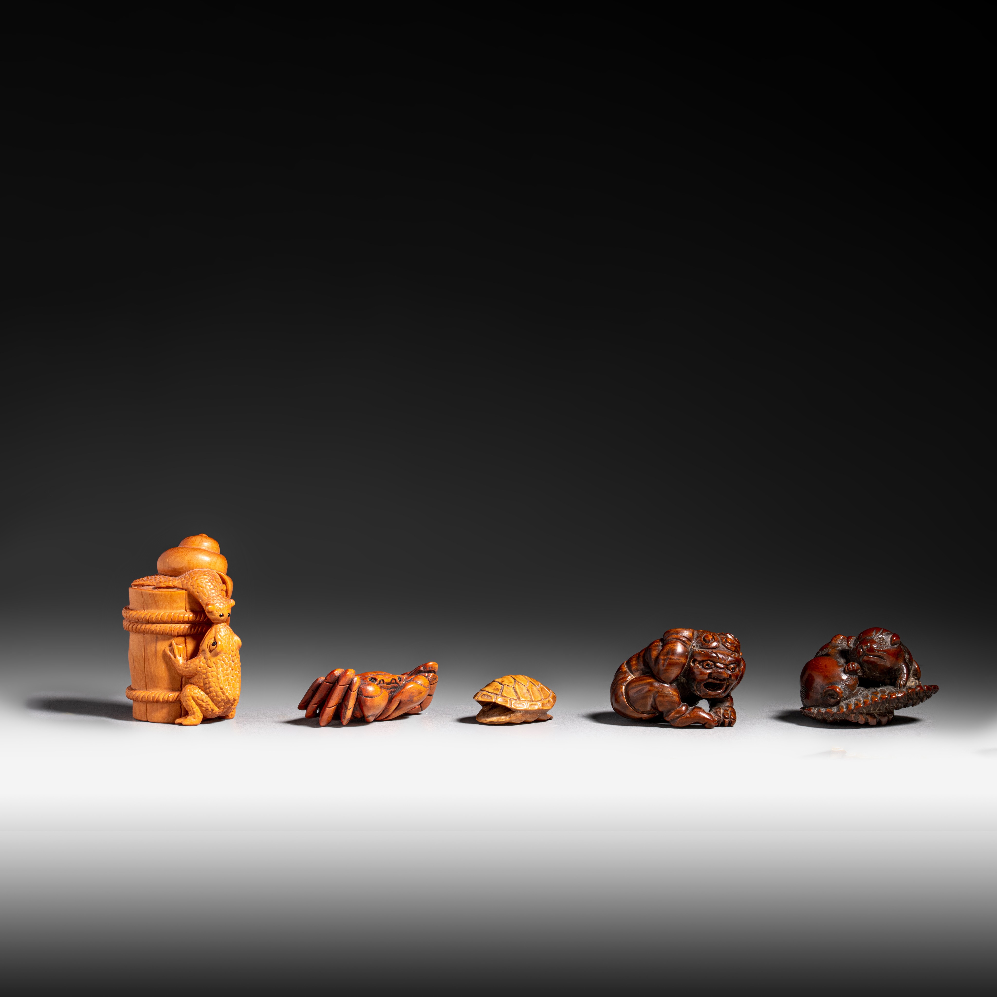 Four netsuke and a ditto ojime, 19th/20thC, H 5,4 cm - W 4,6 cm - W 4,1 cm - W 3,9 cm - H 2,8 cm