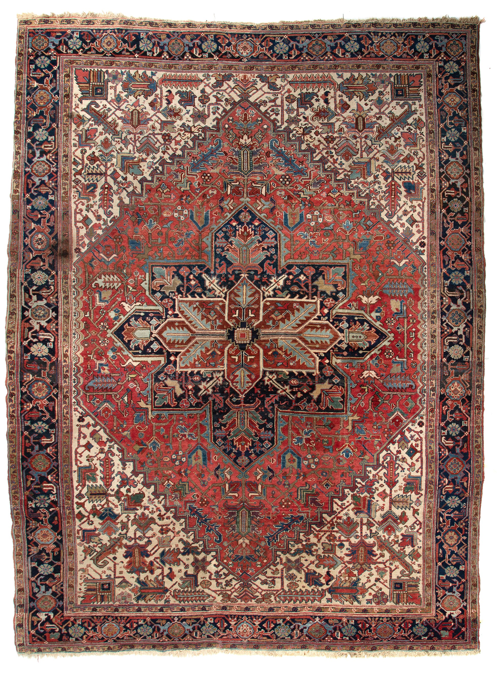 An Oriental woollen rug decorated with geometrical motifs, 280 x 388,5 cm