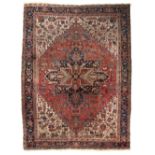 An Oriental woollen rug decorated with geometrical motifs, 280 x 388,5 cm