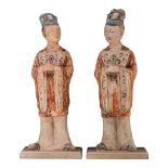 A series of two large Chinese painted pottery figures of officials, Tang dynasty, Total H 64,5 cm