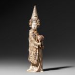 A Japanese ivory okimono of a lady with a drum, Meiji period, H 25,8 cm, 567 g (+)