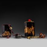 Two Japanese, Meiji period black lacquered five-part inro with their netsuke and ojime