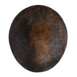 An oval shot-proof steel target, 17thC with later painted decoration, H 61 cm