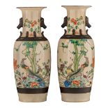 A pair of Chinese famille verte on crackle-glazed Nanking stoneware vases, paired with lion handles,