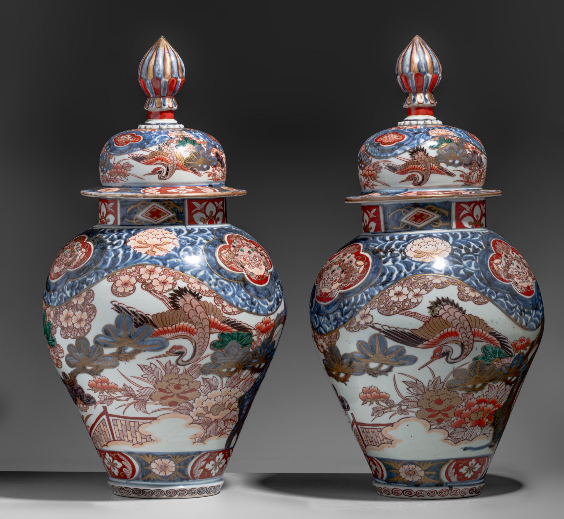 A similar pair of large Japanse Imari 'Crane' vases and covers, Edo period, late 18thC, H 64,5 cm - Image 2 of 9