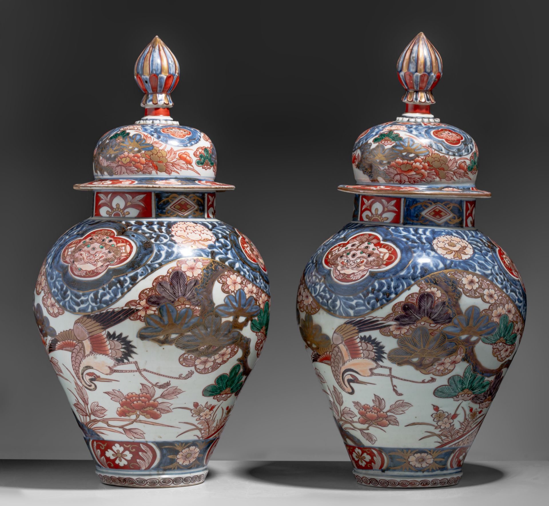 A similar pair of large Japanse Imari 'Crane' vases and covers, Edo period, late 18thC, H 64,5 cm - Image 4 of 9
